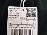 a close up of a black sweater with a price tag on it