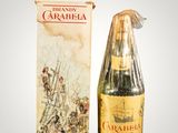 a bottle of wine that is next to a box