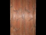 an old wooden cabinet with two doors and a black background