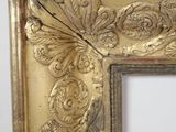 an image of a gold frame with a decorative design on it
