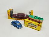 two toy cars and a boat in a box