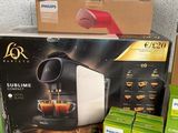 many boxes of coffee machines on the counter in the store