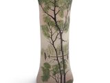 tall vase with a painting of trees and birds on it