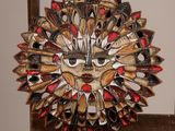 a picture of a decorative mask made out of spoons