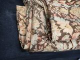 a black couch with a floral pattern on it