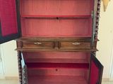a cabinet that has a door open on it