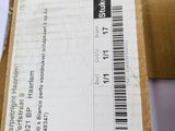 a cardboard box with a receipt on it sitting on top of a table