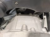a close up view of a motorcycle engine with nozzles