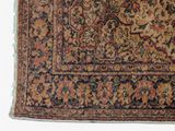a rug with a floral design on it on a white surface