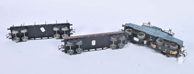 three toy trains that are sitting on a white surface