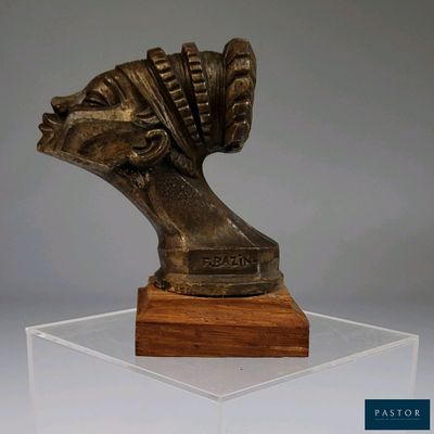 statue of a woman ' s head on a wooden base on a clear acrylic base