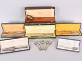 five different types of silverware in a case