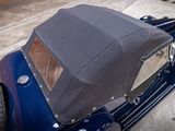 a blue car parked on the side of the road