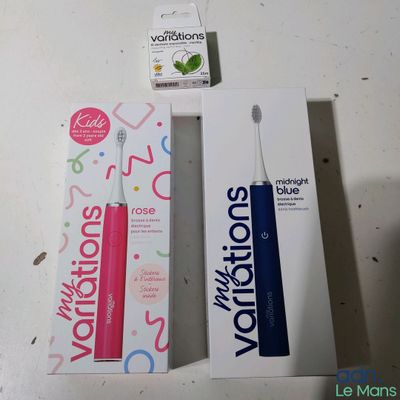a toothbrush and a box of toothpaste on a table