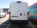 a white van that is parked in a parking lot