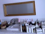 a bathroom with a sink and a mirror on the wall