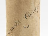 a bottle of wine with a wax stamp on it