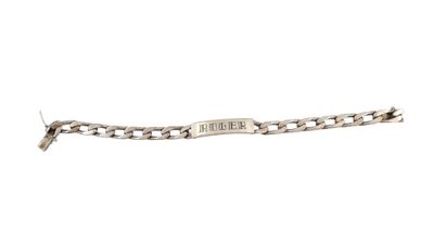 an image of a silver bracelet with a tag on it