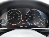 a close up of a car dashboard with a speedometer and gauges