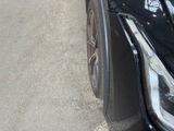 a close up of a car ' s front bumper and headlight