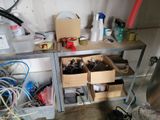 a metal workbench with a lot of tools on it