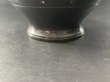 a black bowl that is sitting on a table