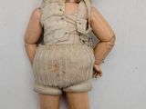 a doll that has a backpack on it ' s back
