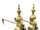 pair of antique brass candlesticks on a stand on a white background