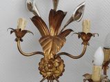 a gold chandelier with five lights on it