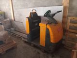 a forklift truck that is parked in a warehouse