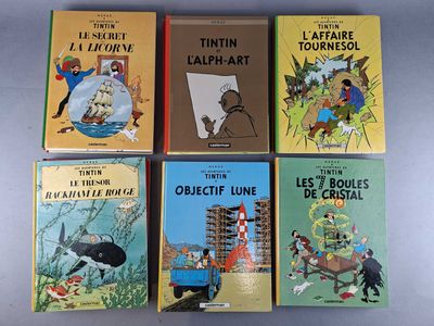 six children ' s books are lined up in a row on a table