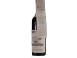 a bottle of wine that is sitting on a table