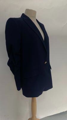 navy blue blazer jacket on a mannequin base