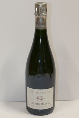 a bottle of wine that is sitting on a table