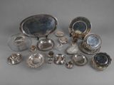 an assortment of silverware including dishes, cups, and spoons
