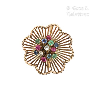 une image d'une bague en or ornée de pierres multicolores