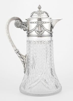 un pichet ancien en argent et en cristal taillé, muni d'une anse