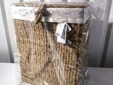 a wicker basket that is wrapped in plastic and sitting on a table