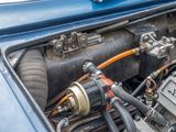 a close up of a car ' s engine with the hood open