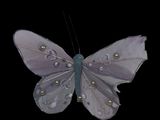 purple and silver butterfly decoration on black background with water droplets