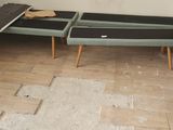 a bench that is sitting in the corner of a room