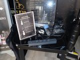 a black table with a mirror and a black bag on it
