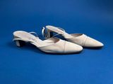 a pair of white shoes on a blue background