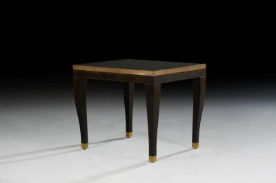 an image of a black and gold side table on a white surface