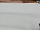 pair of glasses on a white table with a white background