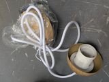 a picture of a piece of plastic wrapped in plastic with a white cord
