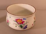 a white bowl with a floral design on it