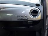 a close up of a car ' s dashboard with the door open