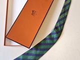 a tie that is laying on a table next to a box