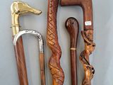 four different types of walking canes on a table
